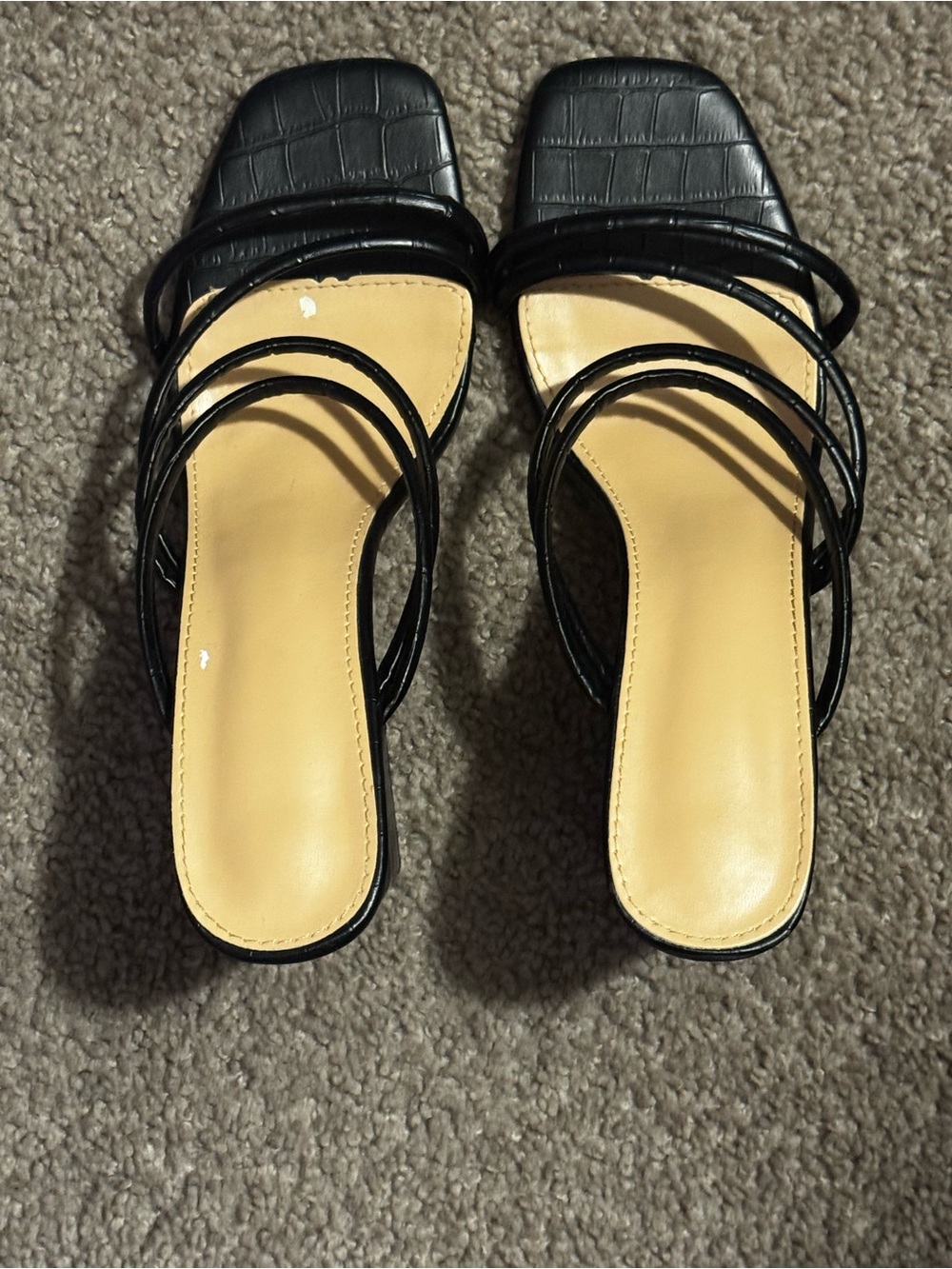 Black textured block heels with strappy design